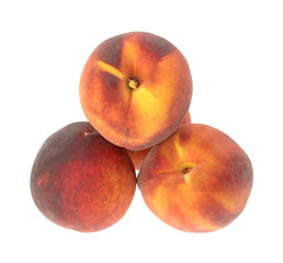 Whole nectarines on a white background.