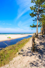 A view of white sand beach and Plasnica river estuary to Baltic Sea, Debki coastal village, Poland