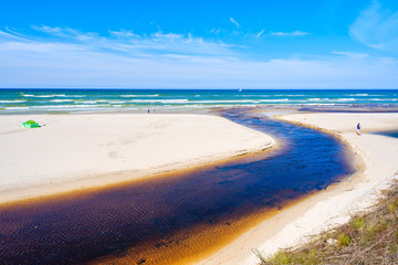 Plasnica river estuary to sea on sandy beach in Debki village, Baltic Sea, Poland