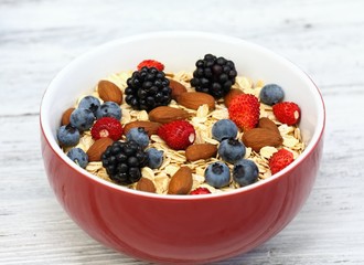 Breakfast oatmeal & wild strawberries, blueberries, blackberries & almonds  