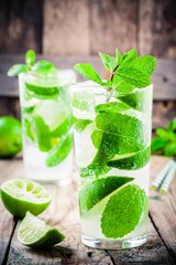 fresh mojito cocktails with lime, mint and ice in glass