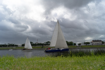 yacht sails along the river
