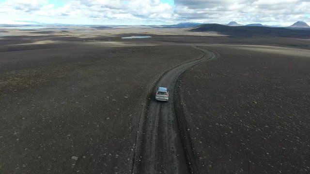 Driving through the barren highlands in Sprengisandur, Iceland.