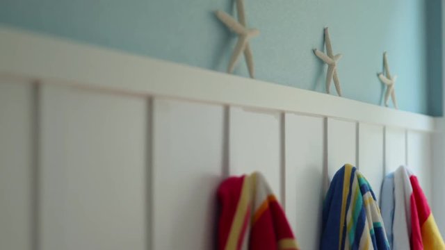 Interior of beach home with starfish and towels