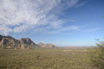 Cloudy sky over mountain background