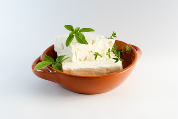 Feta cheese on brown plate