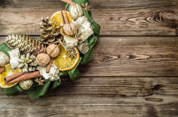 Christmas wreath with dried fruits on wooden door