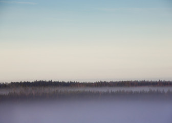 Amazing view in the morning. Foggy sunrise fills the forests below.