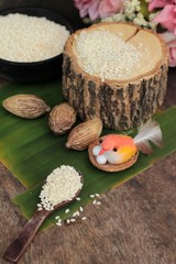 White sesame seeds organic on wood background.