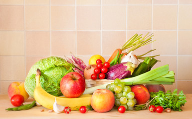 Various fruits and vegetables on kitchen table