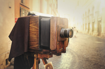 Wooden retro camera outdoors - Powered by Adobe