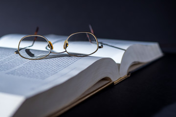Book with reading glasses