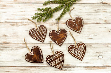 Hanging decoration shaped heart on christmas tree.
