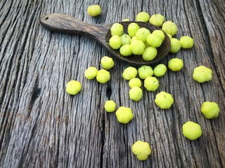star gooseberry in wood spoon on wooden background