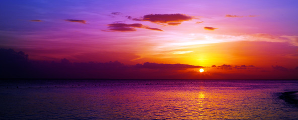 Naklejka na ściany i meble Colorful sea sunset.