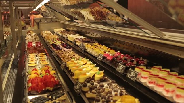 A shop window with cakes