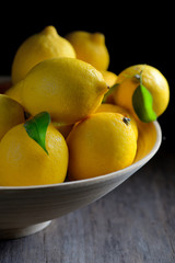 Fresh lemons with leaves