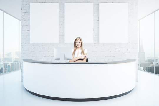 Cheerful Woman At Reception Desk