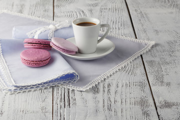 Cup of coffee serving on shabby chic background
