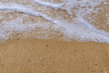 Sea wave buble with sandy shore