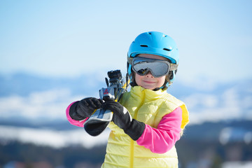 Skiing, winter fun,happy  skier girl enjoying ski holiday