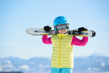 Skiing, winter fun,pretty skier girl enjoying ski holiday