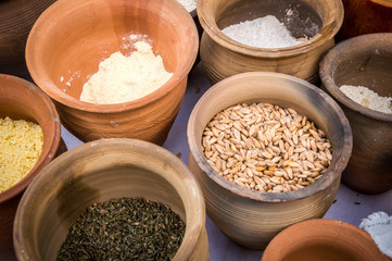 Slavic dry food products in an earthenware pots.