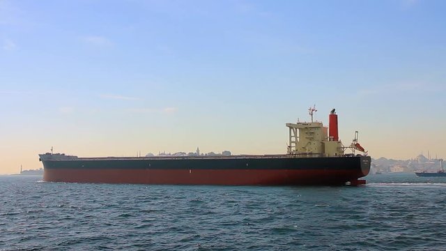Tanker ship on route to open sea. Side view of the crude oil tanker. High Definition, tracking video. Oil Tanker Ship
