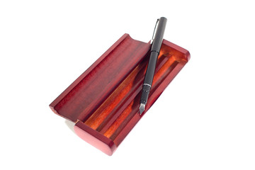 isolated fountain pen in wooden case made of mahogany