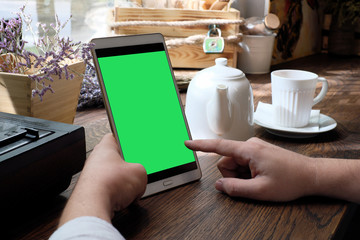 Tablet computer empty screen in man hands.