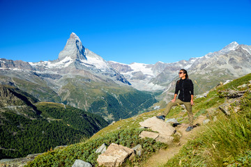 Fototapeta premium Matterhorn - Hiker in beautiful landscape of Zermatt, Switzerlan