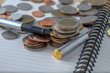 business finance. save money for investment concept coins and pe