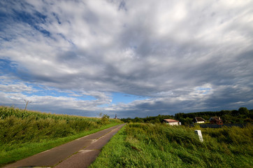 Country road under a cloudy sky