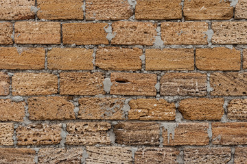 Background. The texture of the stone wall. Coquina material fastened with cement mortar