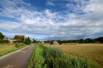 Country road under a cloudy sky