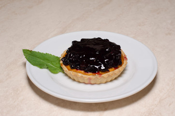 Fresh berry tartlet or cake filled with custard