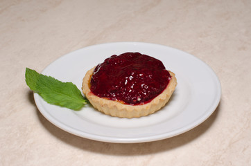 Fresh berry tartlet or cake filled with custard