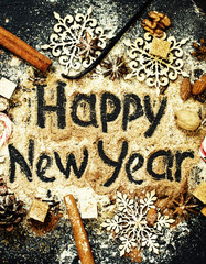 Christmas background with winter spices with the words happy new