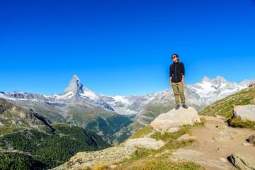 Matterhorn - Hiker in beautiful landscape of Zermatt, Switzerlan