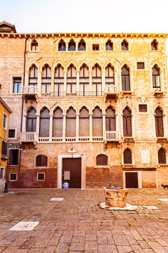 Bright colored house in Venetian style in San Beneto square in Venice in the evening. Campo San Beneto. Italy