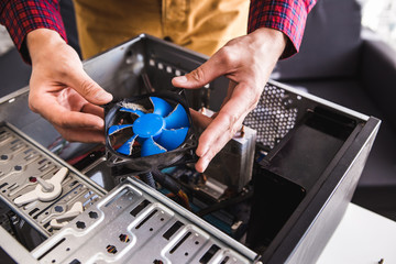 Computer literacy repair men hands, man examines laptop clean thermal paste, dust pollution, fan