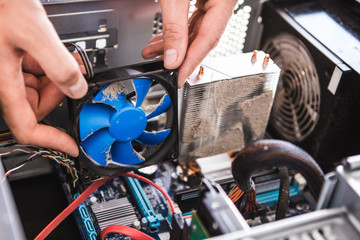 Computer literacy repair men hands, man examines laptop clean thermal paste, dust pollution, fan