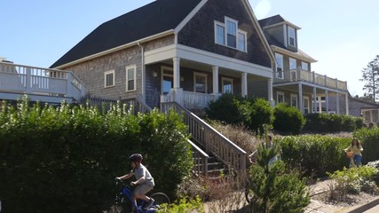 Family riding bikes in coastal community