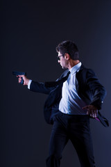 Brave cool man holding a gun