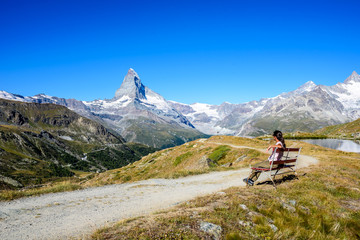 Fototapeta na wymiar Matterhorn - Hiker in beautiful landscape of Zermatt, Switzerland