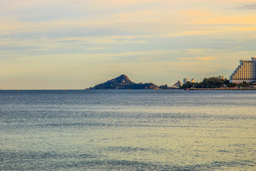 Mountain in the middle of the sea in sunset sky, Thailand