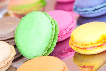 Fototapeta na wymiar Colorful french sweets macarons on wooden table