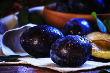 Juicy plum blue, vintage wooden background, selective focus