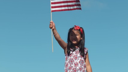 Girl waving American flag in slow motion, shot on Phantom Flex 4K