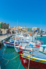 Fototapeta na wymiar Fishing Boats and Heraklion Promenade, Crete